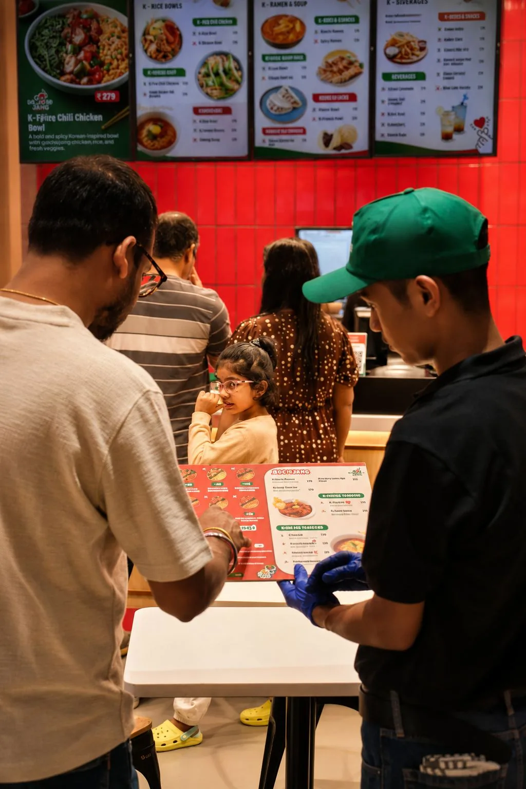 Guests choosing from the Gochujang menu at the counter
